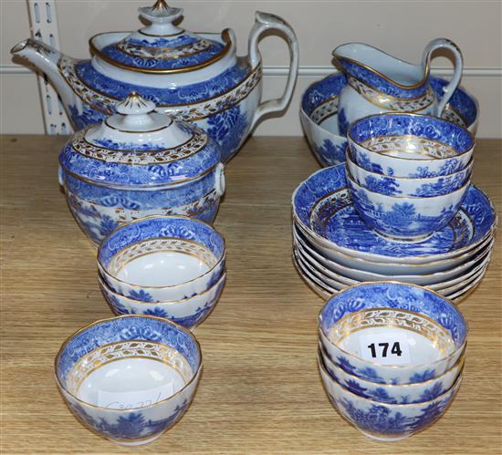 A 19th century English blue and white part tea service with gilt decoration